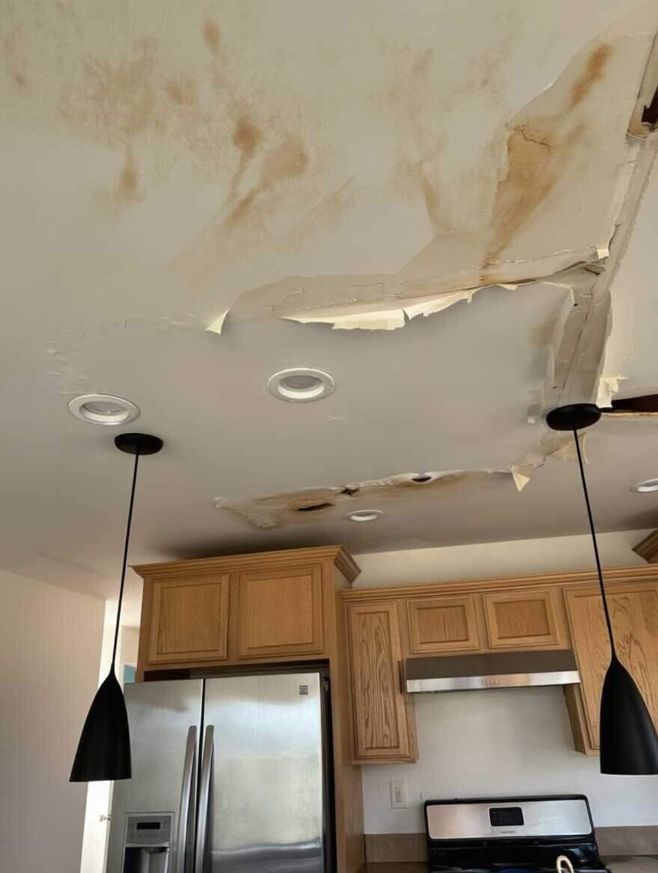 Water-stained, sagging ceiling from a leak