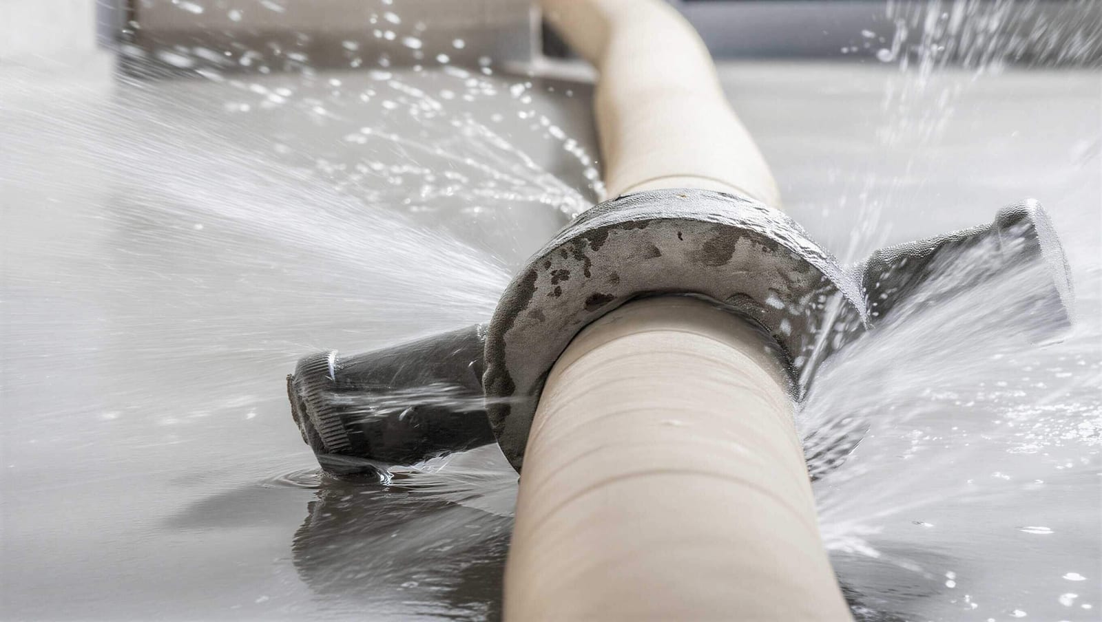 Water escaping from a burst pipe in a home